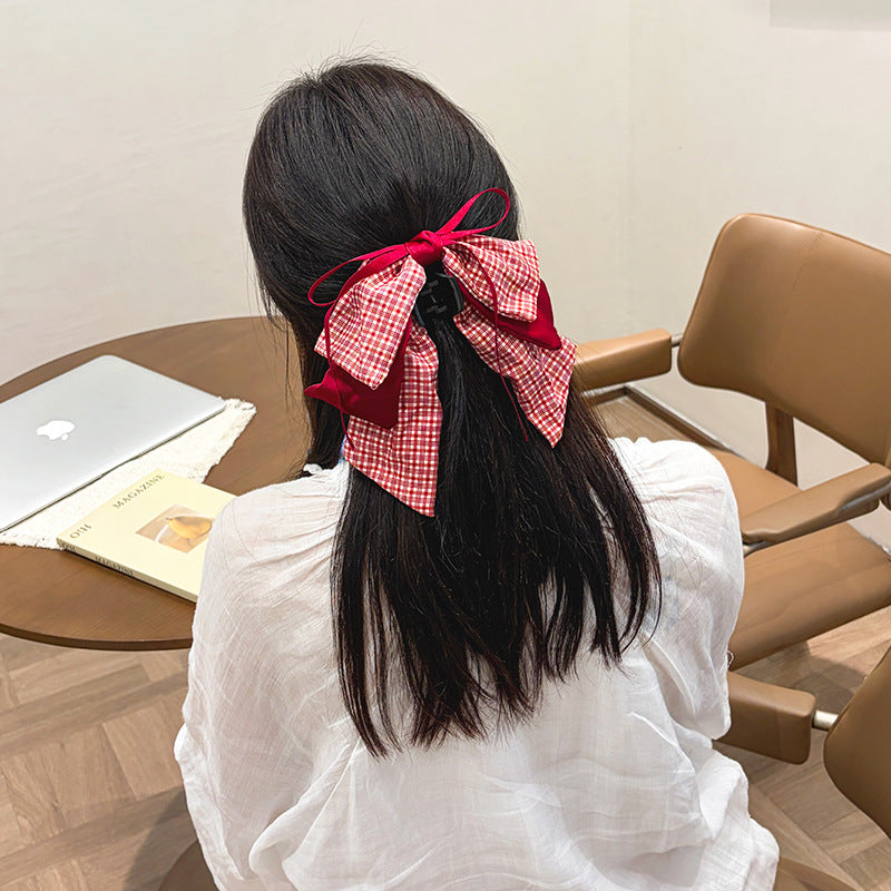 Clip à cheveux de style princesse de petite fille avec un arc rouge