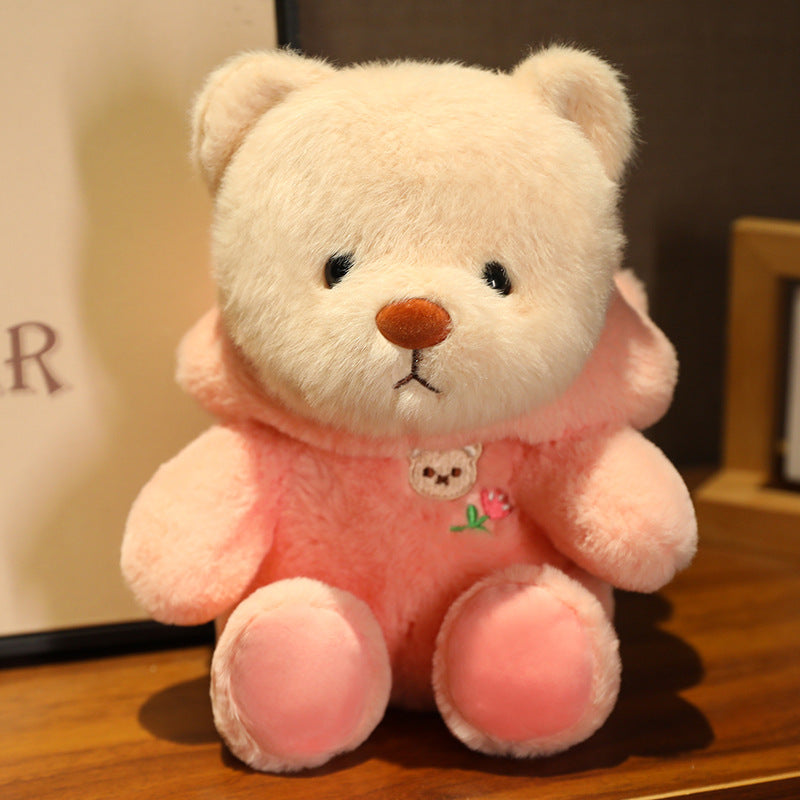 Logo de tête d'ours mignon se transforme en une poupée en peluche douce et adorable de la série Ours