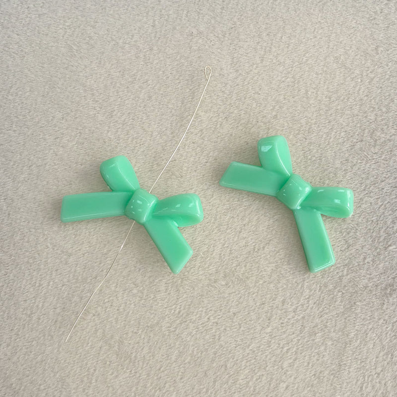 Perles d'espacement en forme de Bowknot acrylique