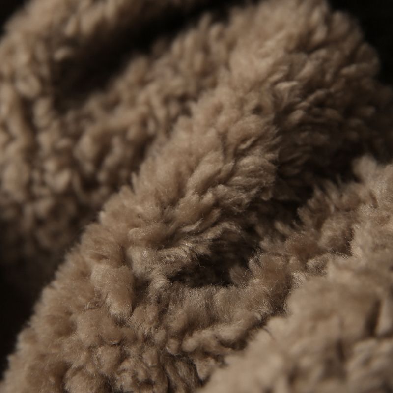 Manteau court doublé en cuir et en fourrure combiné avec du lambswool