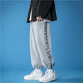 Mode masculine des pantalons occasionnels de pied de cravate