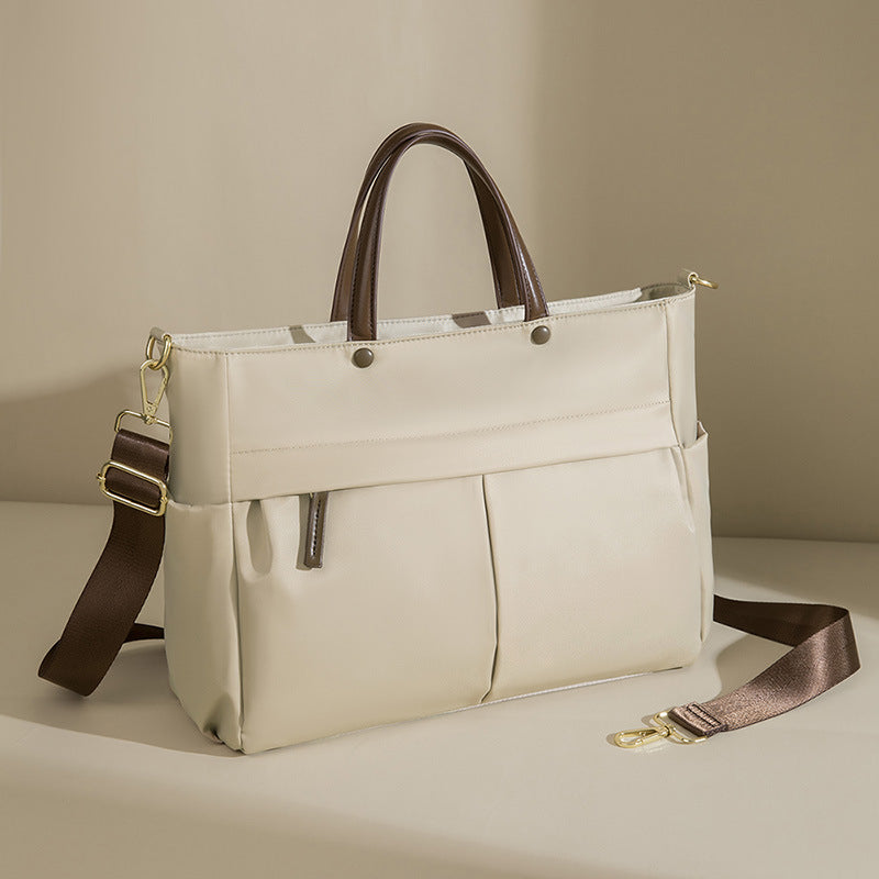 La mallette portable femme de mode grande capacité