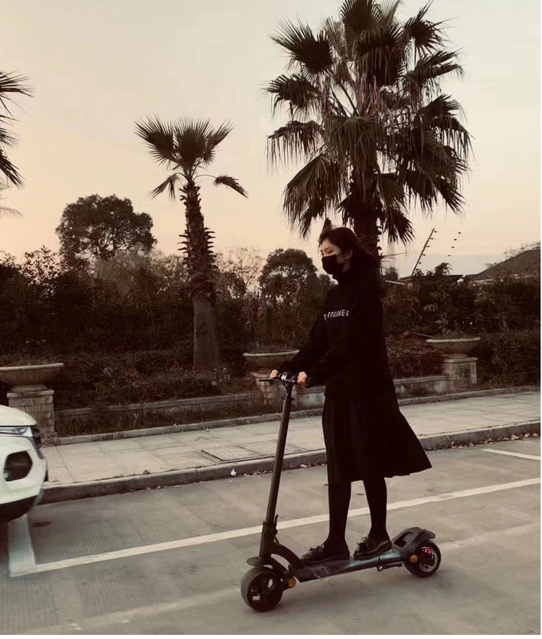 Scooter pliant double disque avec pneus larges