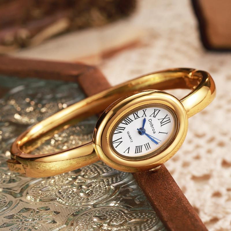Montre femme ovale Niche légère-luxe avec une lunette diamant or rose
