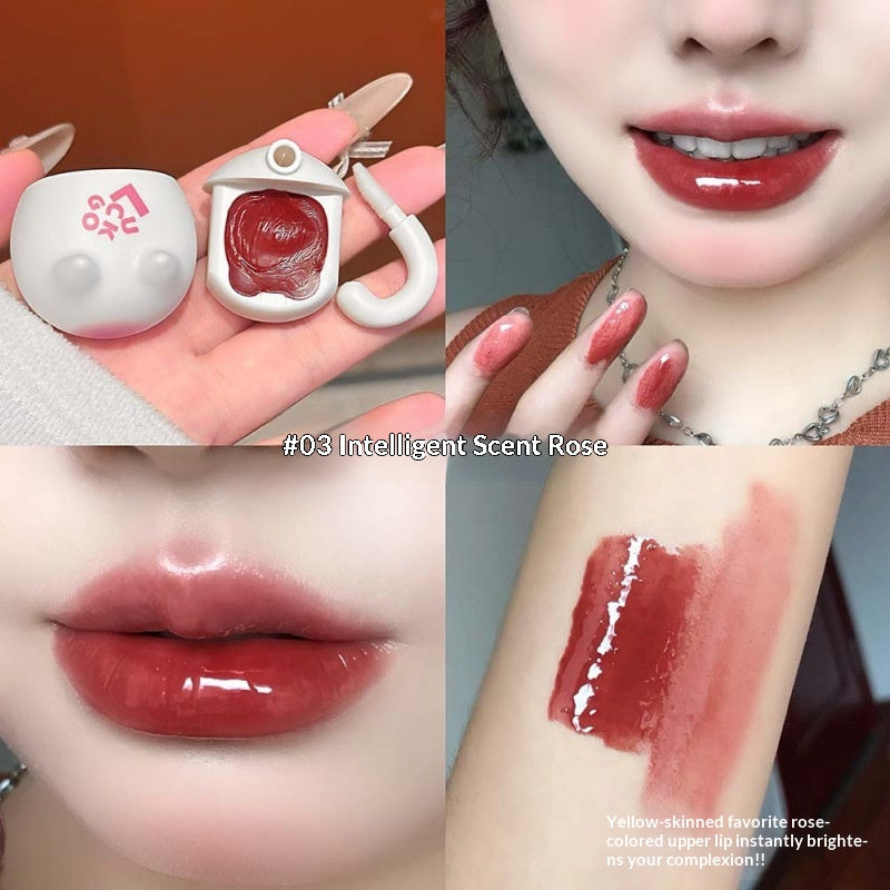 Orange Cat Lip Glaze Sheer et jeune avec une finition miroir comme Dewy