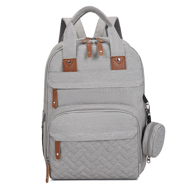 Sac à couches multifonctions avec un tampon à langer bébé et un compartiment chauffant