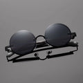 Lunettes de soleil vintage à cadre rond pour femmes Style de punk en métal avec des temples en grain de bois élégant et