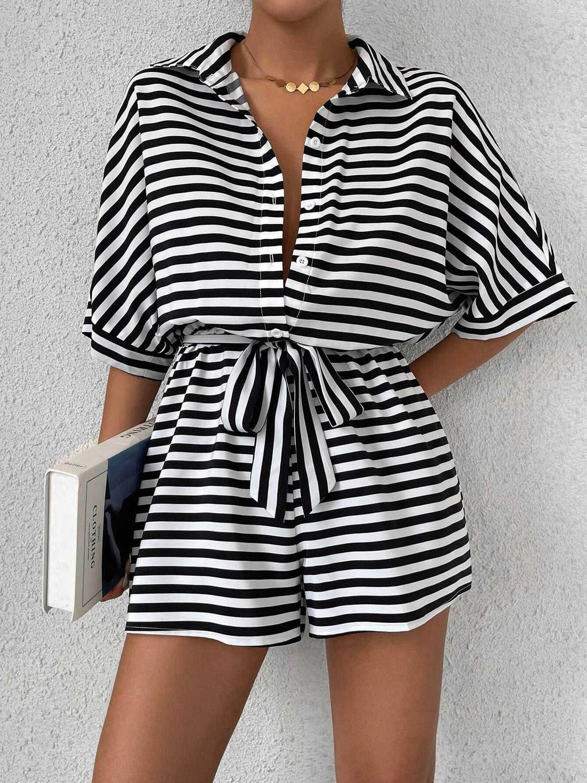 Striped summer jumpsuit featuring a lapel collar, button-front cardigan style