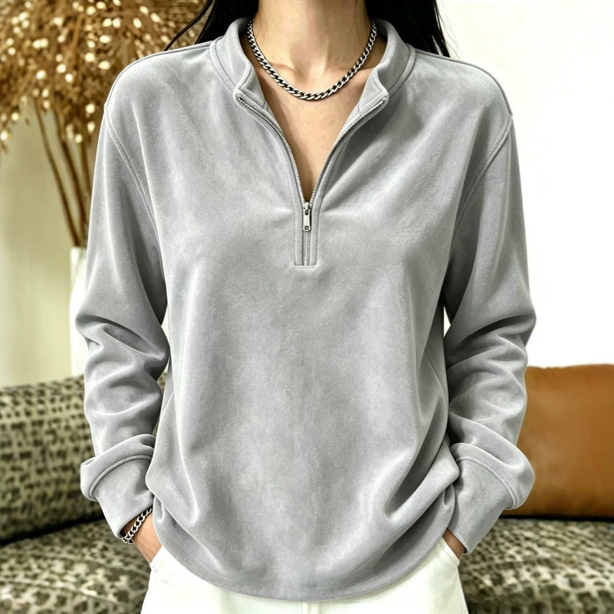 Top à manches longues de couleur unie avec un collier et une fermeture éclair