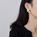 Boucles d'oreilles en métal de fleur de pétal vintage aiguille d'argent