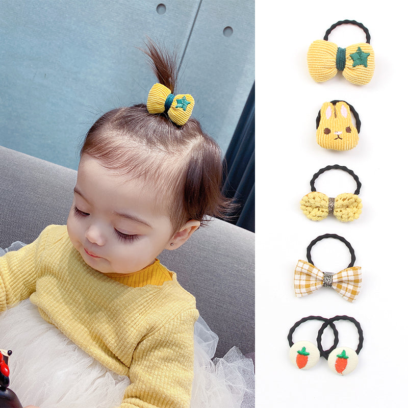 La bande de caoutchouc de Huang Xiaoniu Baby ne lui fait pas mal aux cheveux