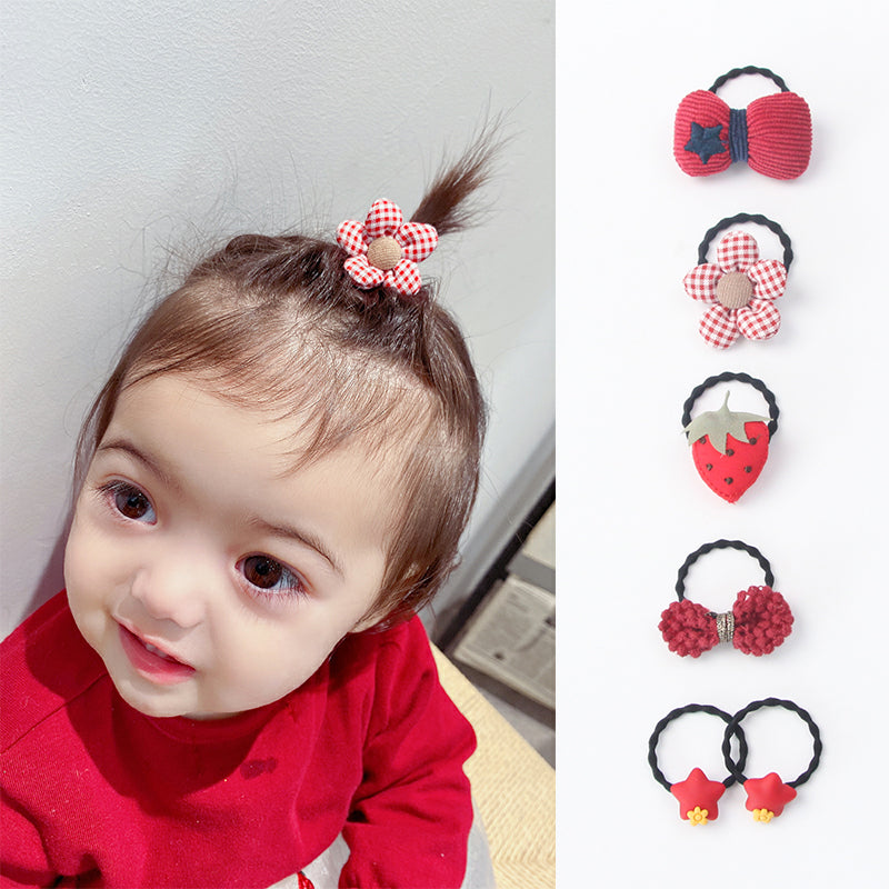 La bande de caoutchouc de Huang Xiaoniu Baby ne lui fait pas mal aux cheveux