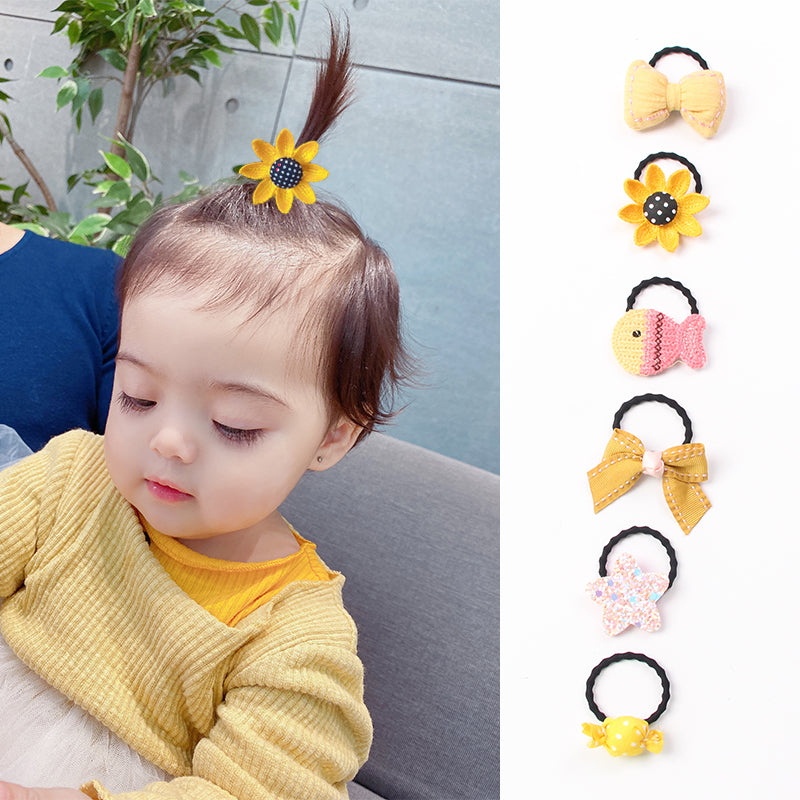 La bande de caoutchouc de Huang Xiaoniu Baby ne lui fait pas mal aux cheveux