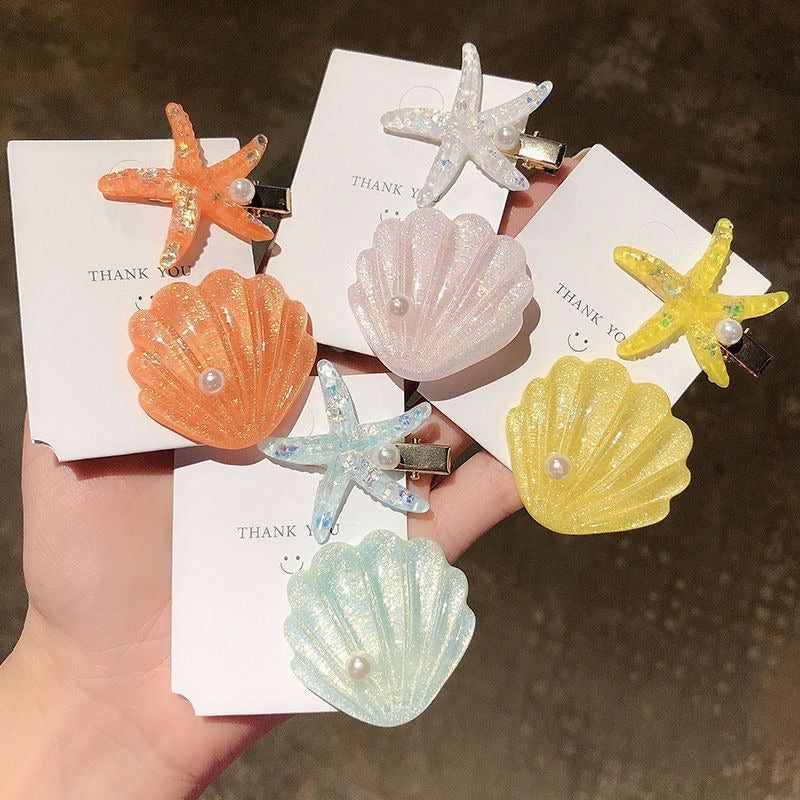 Barrettes d'étoiles de coquillage