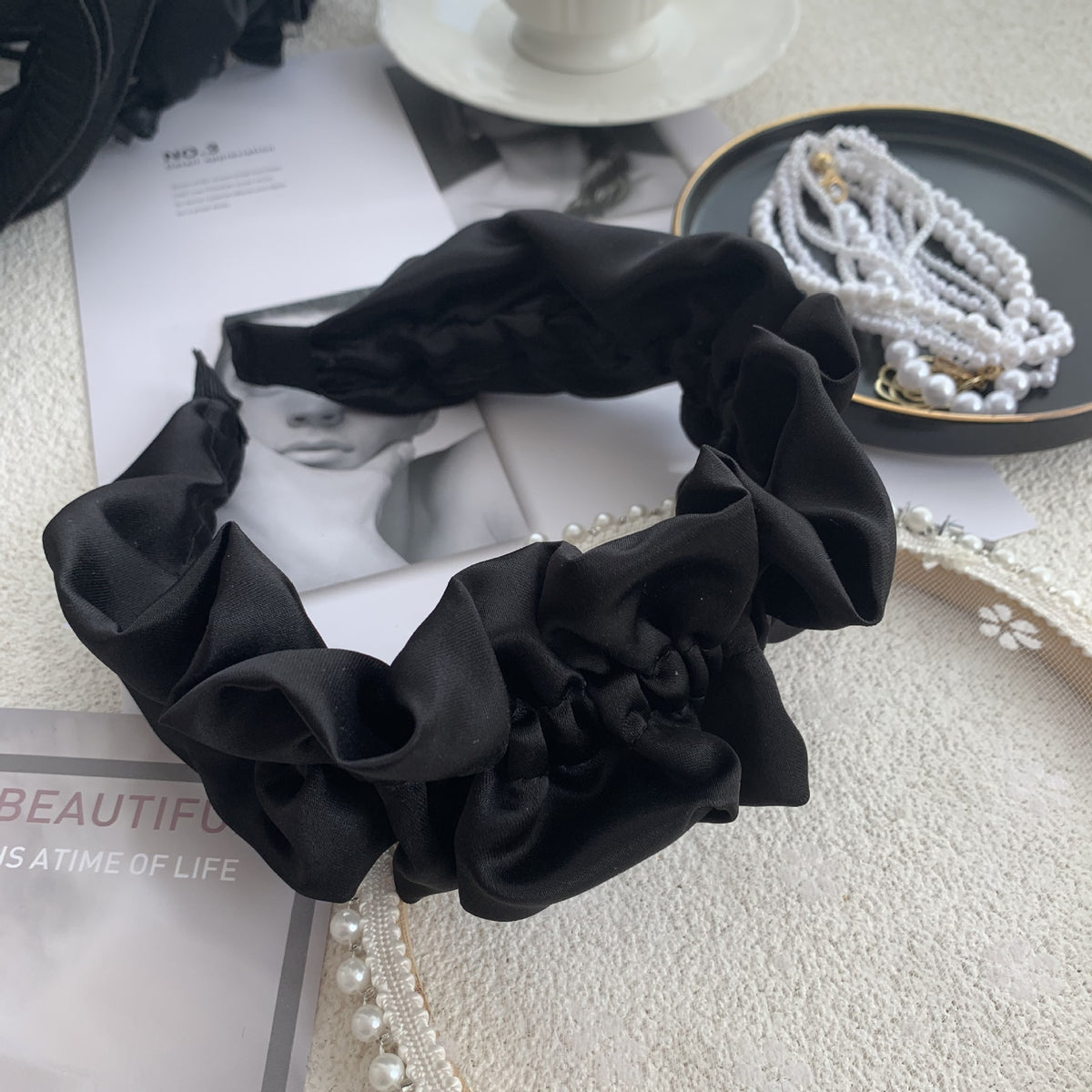 Exaggerated Black Wood Ear Hoop Hairstyle