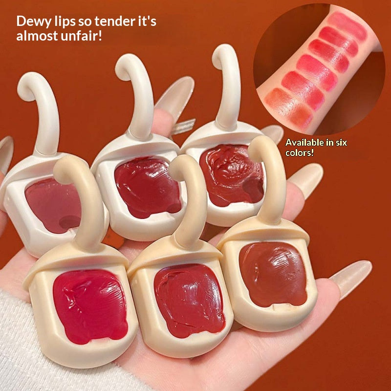Orange Cat Lip Glaze Sheer et jeune avec une finition miroir comme Dewy