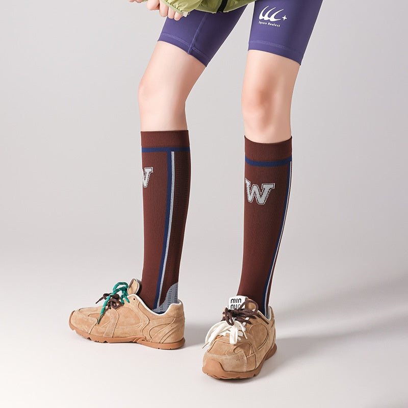Chaussettes de calf à compression progressive pour femmes avec bandes de blocs de couleur