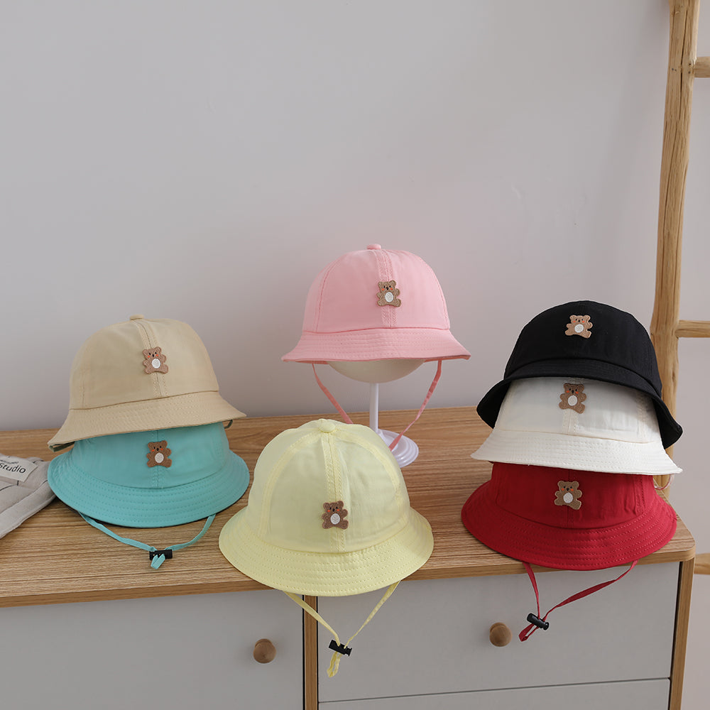 Chapeau de soleil d'été léger de couleur candy pour enfants avec cordon de serrage