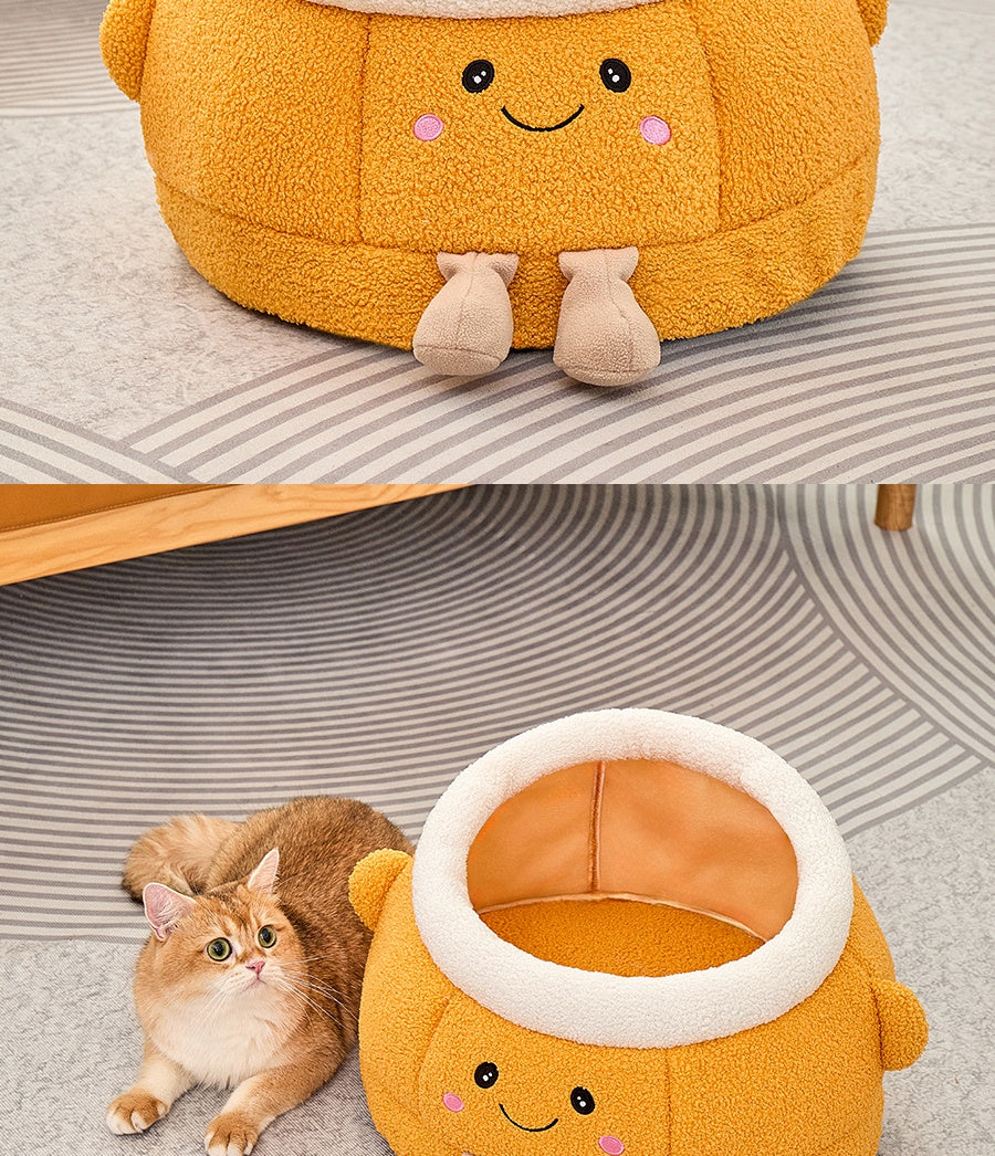 Lit de chat avec sourire orange