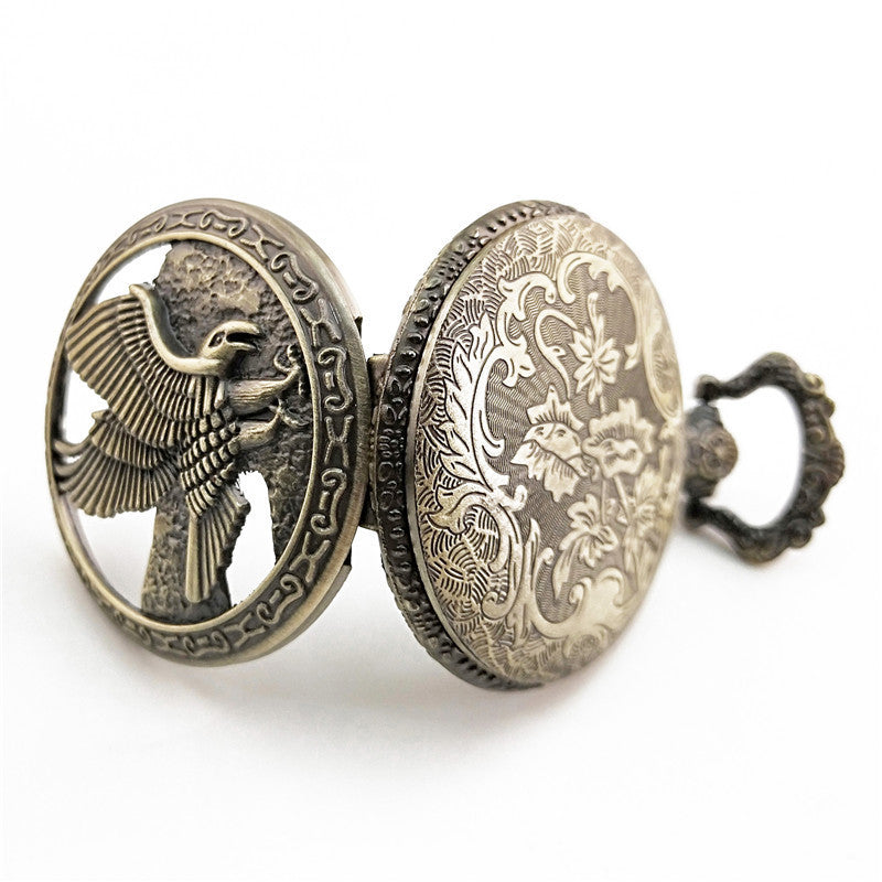 Vieille montre de poche fléchée aux gros oiseaux