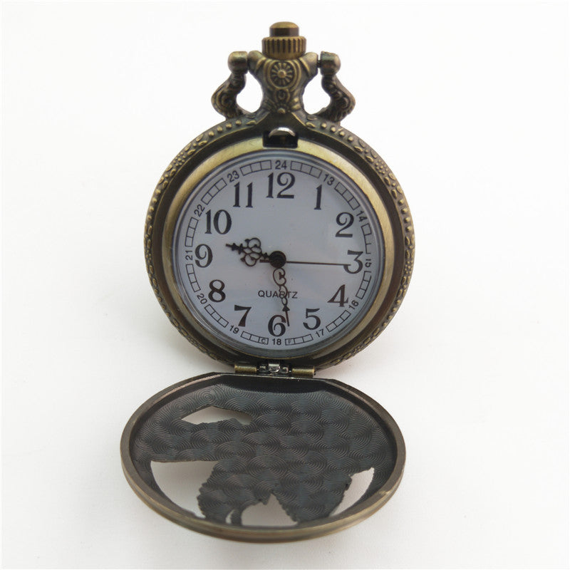 Vieille montre de poche fléchée aux gros oiseaux