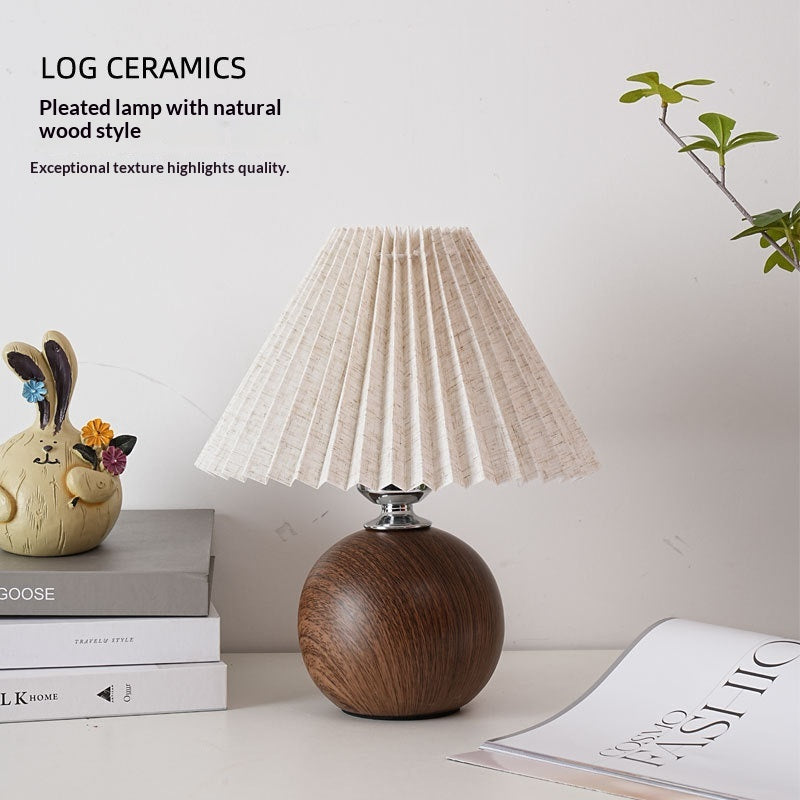 Pleated fabric table lamp with a ceramic base