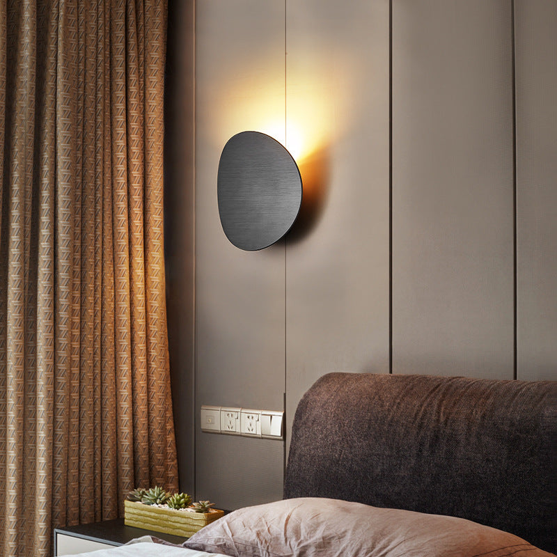 Lampe murale simple côté lit