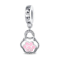 Bracelet bricolage avec un pendentif et des perles d'impression de patte mignon