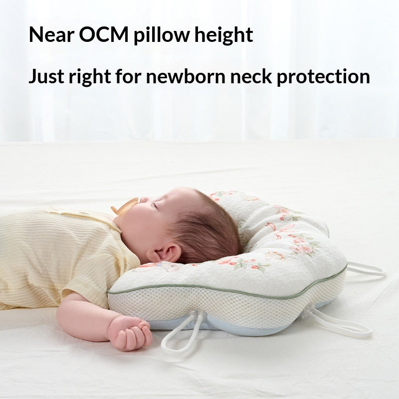Oreiller pour nouveau-nés de plusieurs mois conçu pour corriger la forme de la tête pendant le sommeil