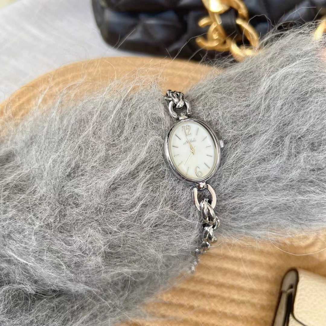 Lady's Steel Strap Watch Or Oval Hollow Chain Quartz Watch