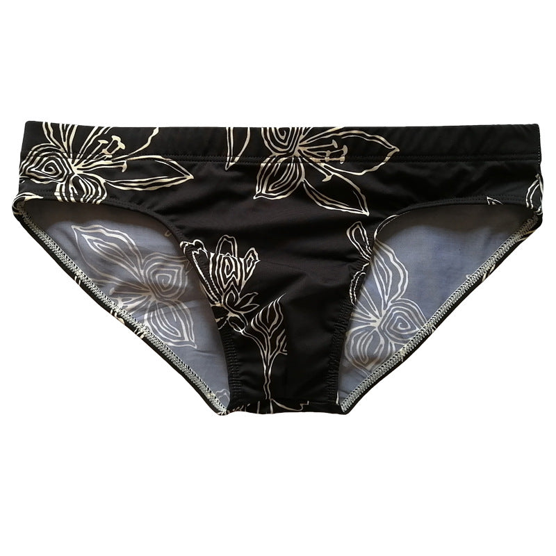 Fond noir Fleur blanche Trunks de natation simples