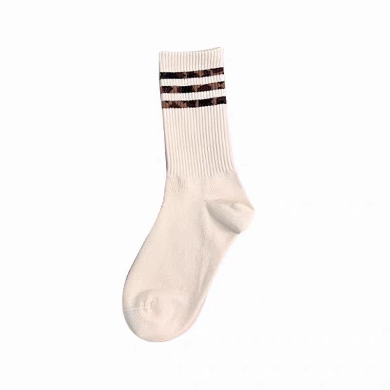 Chaussettes longues mi-calf Femmes Chaussettes de coton à rayures polyvalentes
