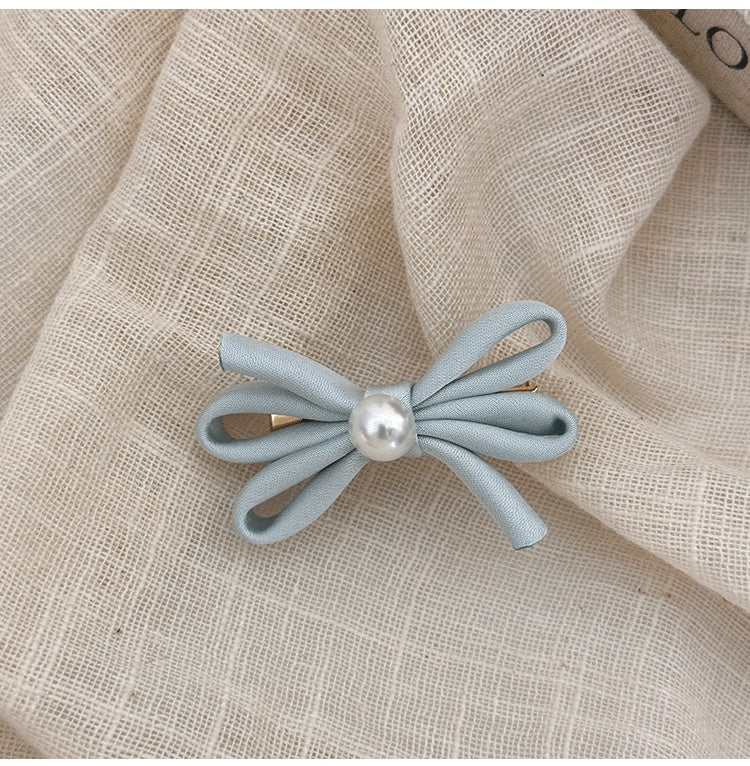Clip latéral Bangs Pearl Bow Une paire de clips de canard