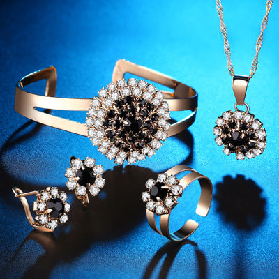 Boucles d'oreilles collier collier de fleur bracelet quatre-pièces ensemble