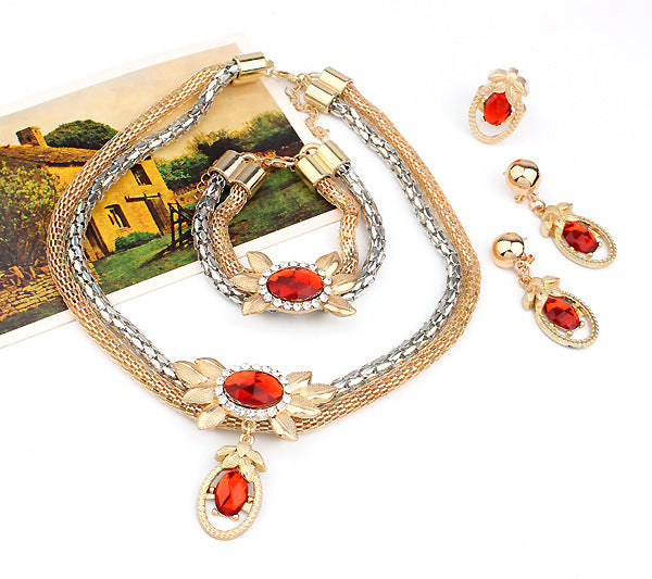 Alliage de mariée quatre pièces d'Europe et d'Amérique double couleur collier de fleur de cristal oreille