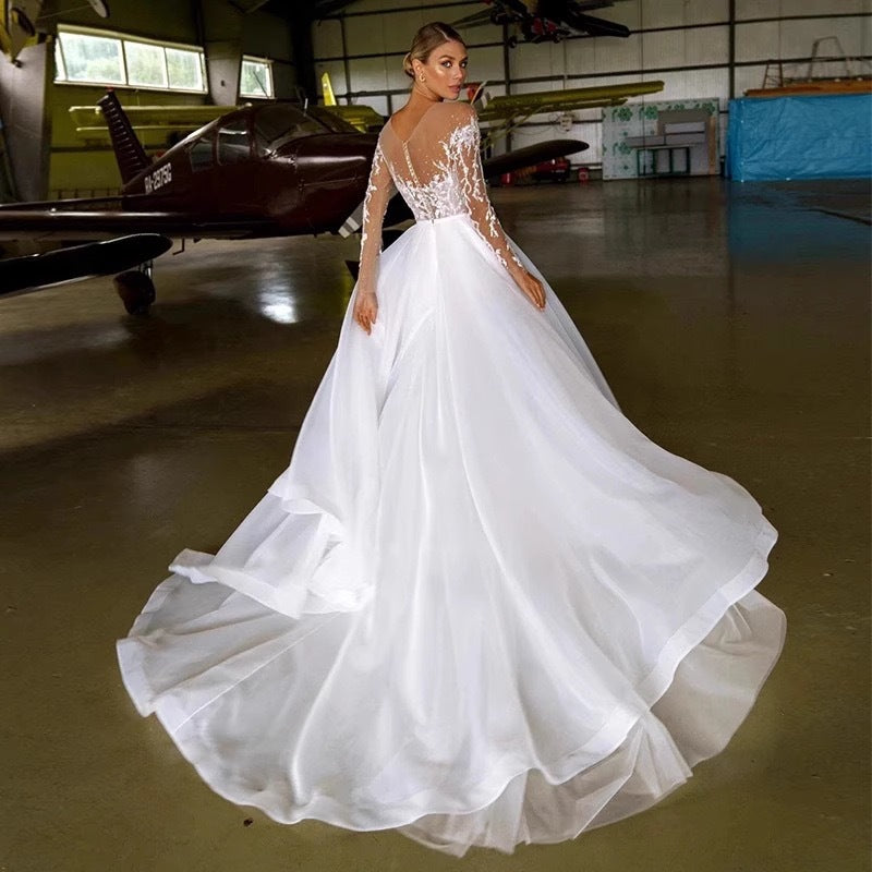 Robe de mariée à manches longues brodées