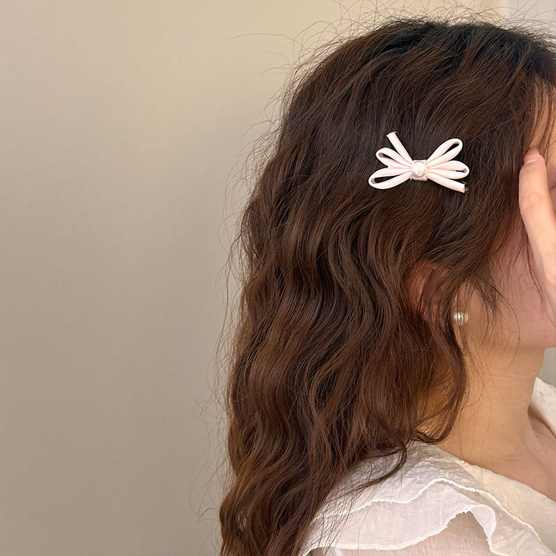 Clip latéral Bangs Pearl Bow Une paire de clips de canard