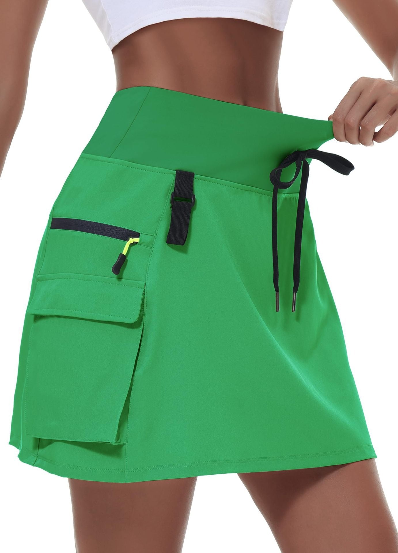 Jupe de tennis à manches rapides en polyester à vente chaude pour femmes avec une taille élastique et des poches zippées
