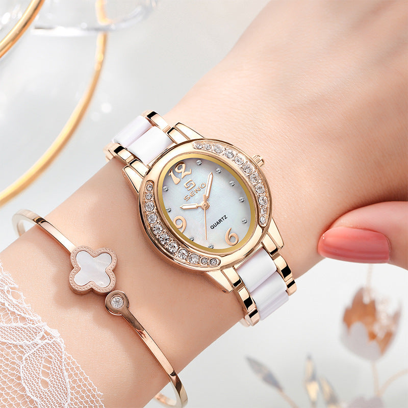 Femmes Montre élégant Oval Diamond incrusté Imperméable Quartz Montre avec une lumière Di