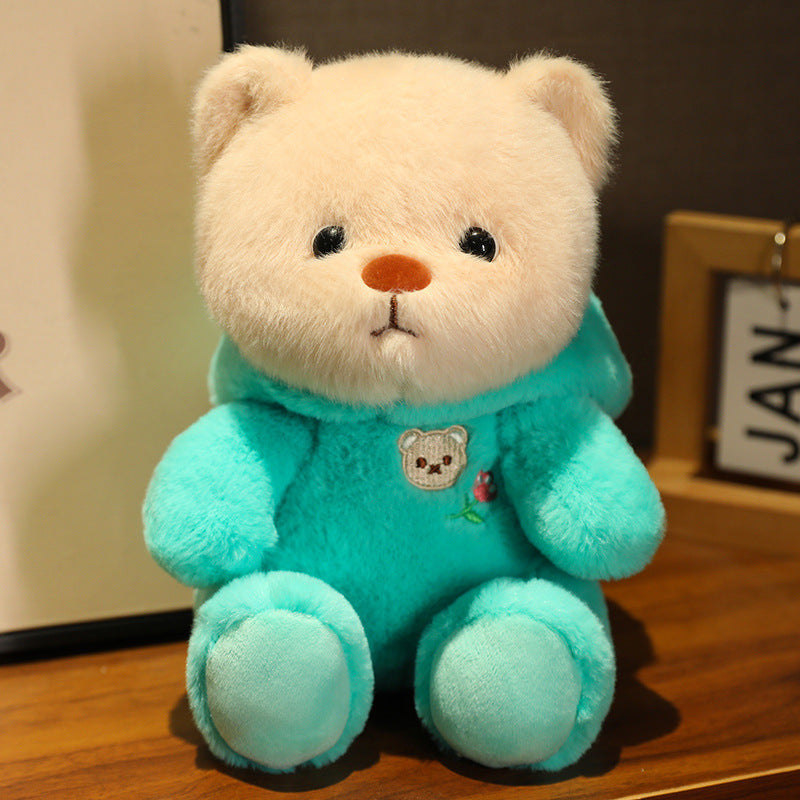 Logo de tête d'ours mignon se transforme en une poupée en peluche douce et adorable de la série Ours