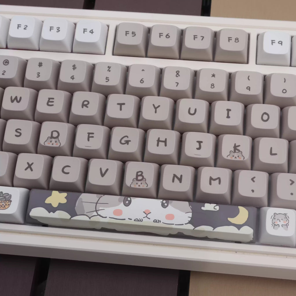 Clavier mécanique gris laiteux sur le thème de la souris