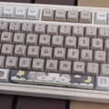 Clavier mécanique gris laiteux sur le thème de la souris