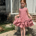 Robe à carreaux sans manches de fille avec arc rouge et jupe à manches multiples