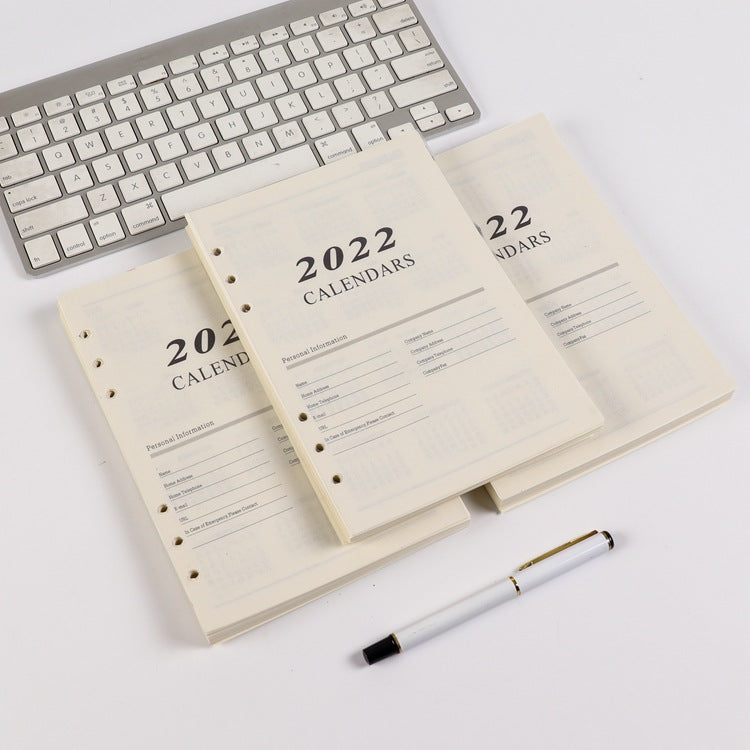 Pages intérieures de carnets à feuillets mobiles avec plan mensuel