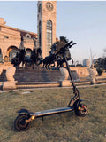 Scooter pliant double disque avec pneus larges