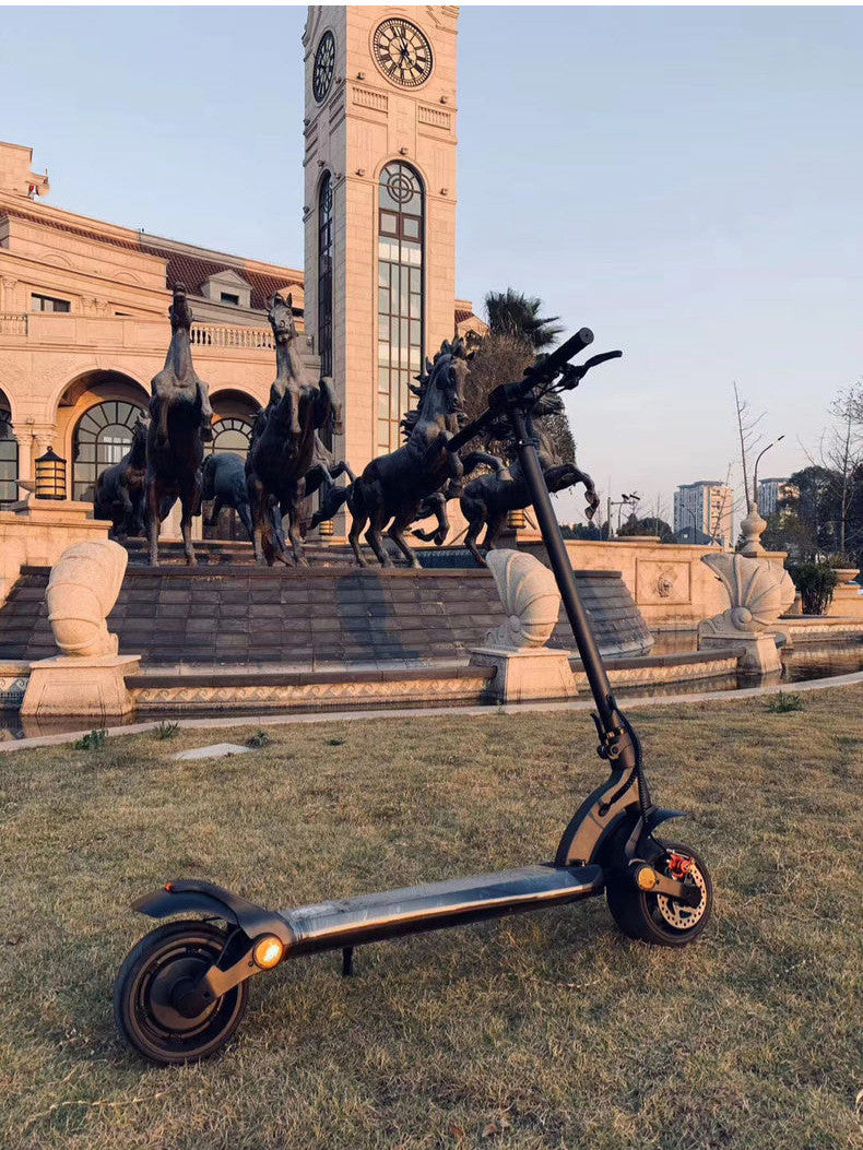 Scooter pliant double disque avec pneus larges