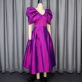 Robe de soirée à manches de puff Une robe de banquet plissée à l'ourlet