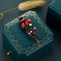 Clip à cheveux vintage en strass couleur paon