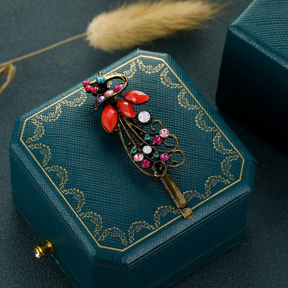 Clip à cheveux vintage en strass couleur paon