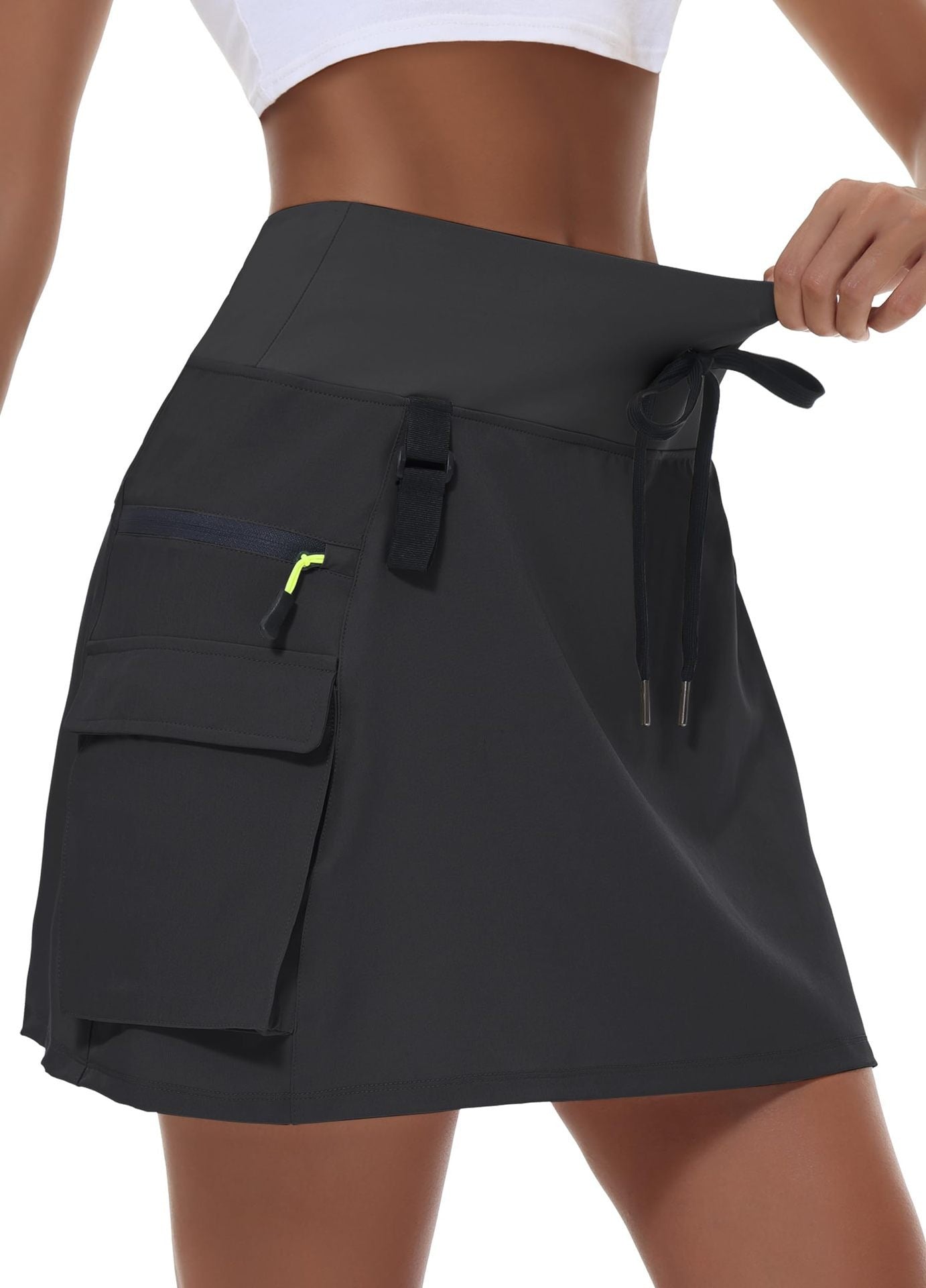 Jupe de tennis à manches rapides en polyester à vente chaude pour femmes avec une taille élastique et des poches zippées